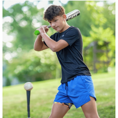 What Is a Smart Bat—And Should Your Kid Use One? 5 Diamond Kinetics SwingTracker: Guy with bat and a Tee